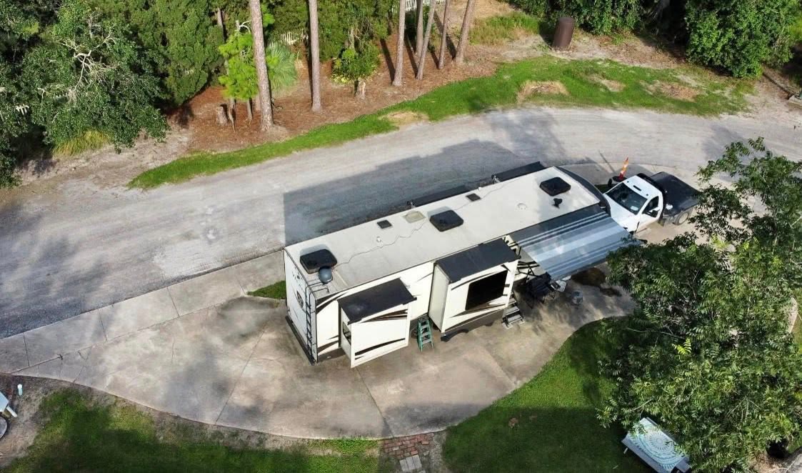 An RV on a concrete site at Sugar Hill.